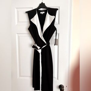 New- black and white sleeveless tuxedo wrap dress by Calvin Klein; size 6